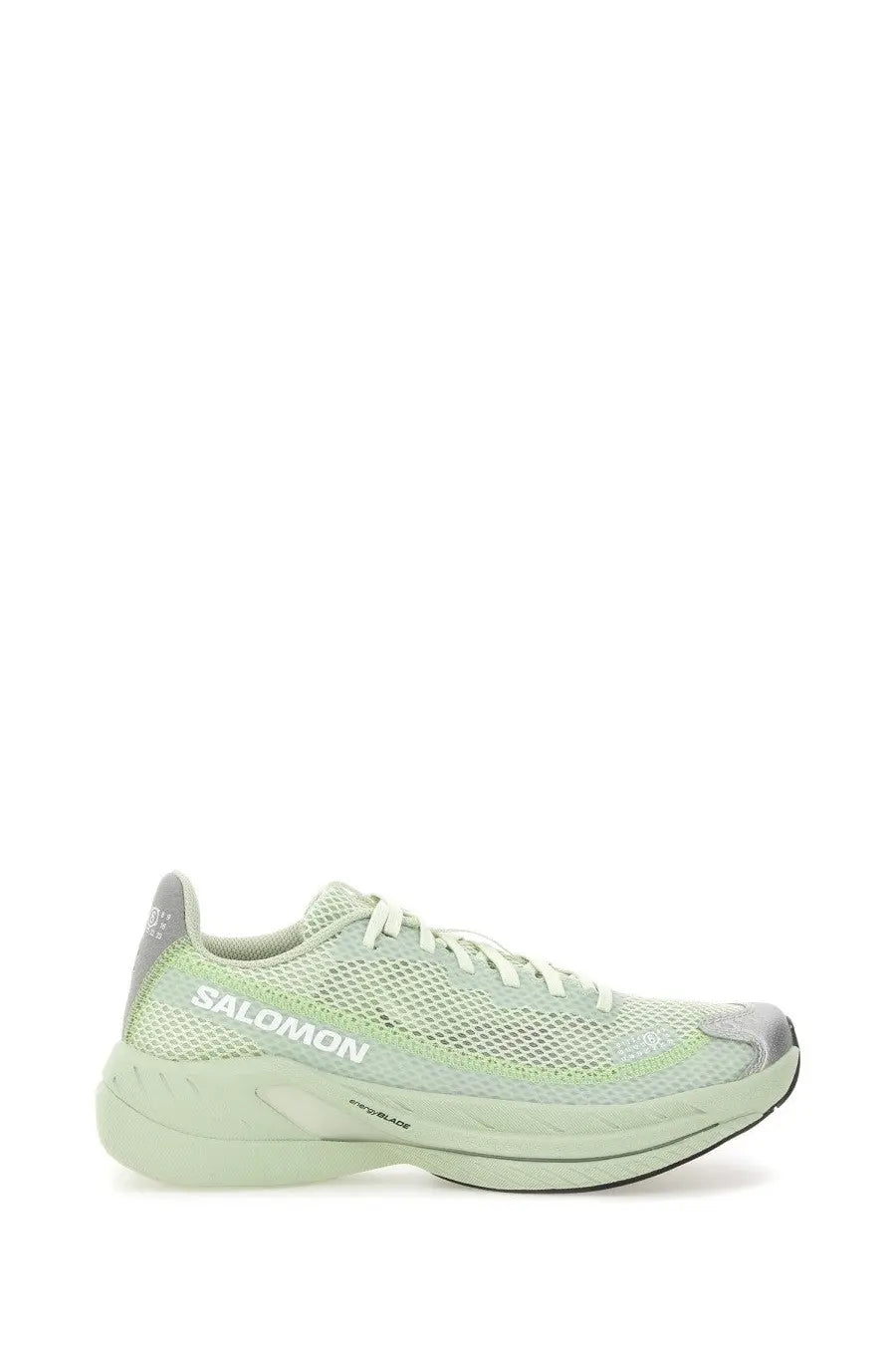 Light green mesh salomon running shoe with gray accents and white laces featured in mm6 maison margiela women’s spectur sneaker white product