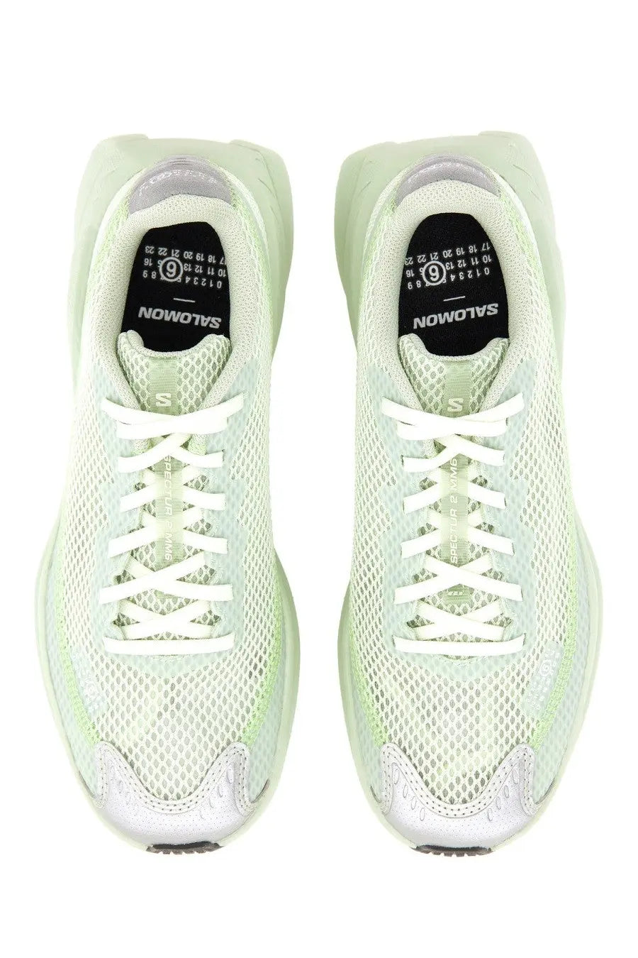 Light green mesh salomon sneakers with white laces and translucent sculpted sole from mm6 maison margiela women