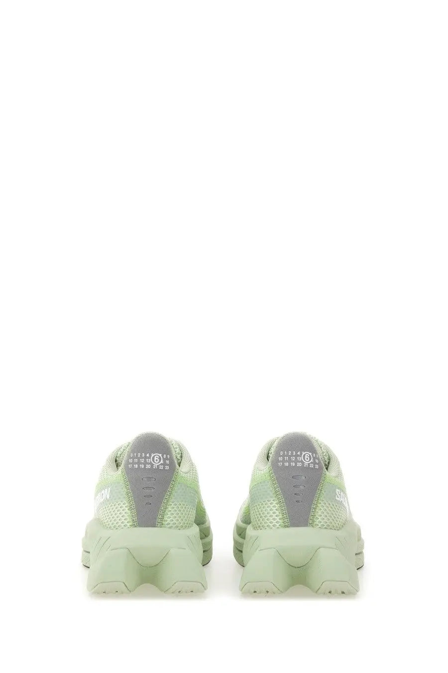 Mm6 maison margiela women’s spectur sneaker in light green mesh with chunky sculpted sole and gray heel branding