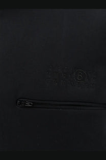 Black leather wallet with embossed calendar design and silver zipper complementing mm6 maison margiela sweatshirt