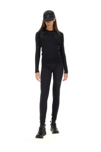 Black long-sleeved snug fit athletic top with subtle chest branding from MM6 Maison Margiela women’s tops black collection