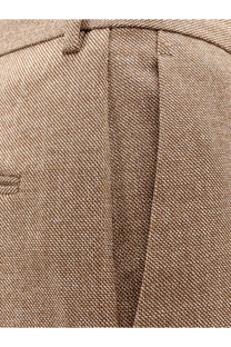 Beige textured virgin wool trousers with subtle herringbone weave from MM6 Maison Margiela women’s collection
