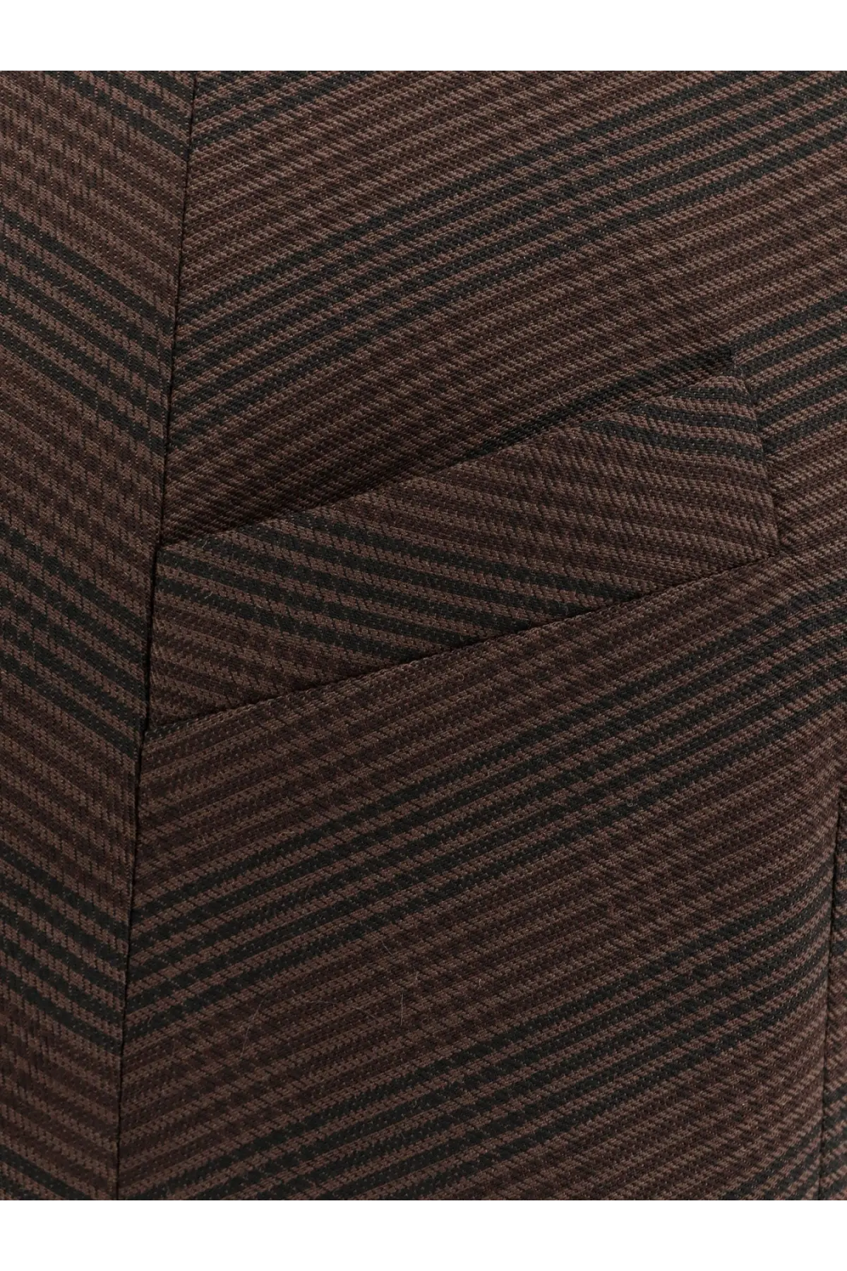 A close-up of brown and black herringbone wool blend fabric from mm6 maison margiela women’s short dress