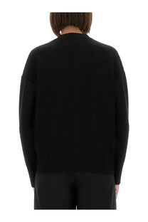 Black knit wool sweater with ribbed hem and cuffs from mm6 maison margiela for women