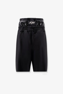 Moncler genius men’s black shorts with glossy elastic waistband, ange logo in white script, and three black front buttons