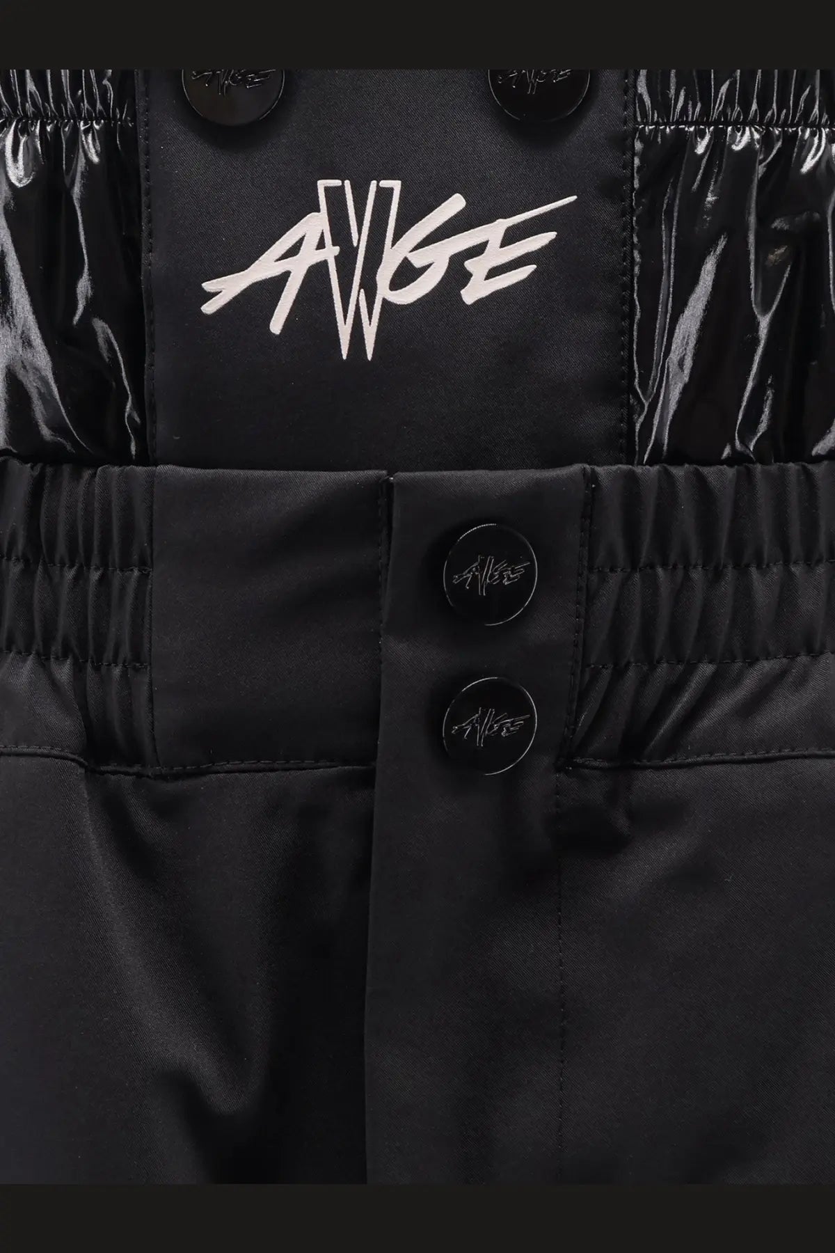 Black shiny nylon Moncler Genius men’s shorts with white avge logo and black buttons in a sleek design
