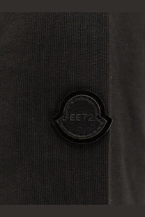 Black moncler ee72 logo patch on dark cotton fabric of moncler genius women’s edward enninful ee72 shirt