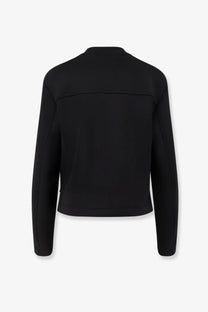 Black long-sleeved cropped jacket with sleek minimalist design in virgin wool by Moncler Genius womens collection