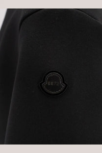 Black moncler logo patch with glossy finish and stitched edge on moncler genius women’s edward enninful wool turtleneck