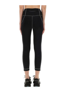 Moncler Grenoble women’s black high-waisted leggings with subtle white stitching along the seams and cuffs