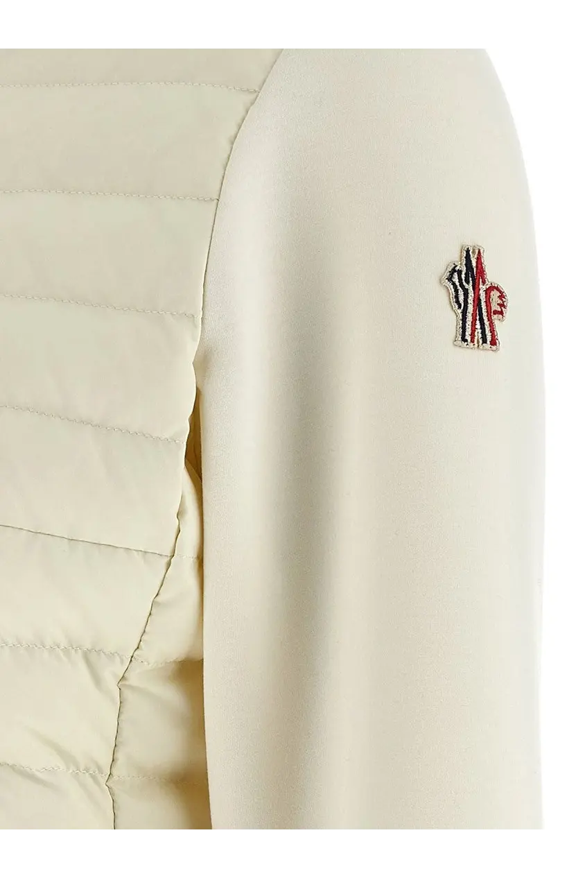 Moncler Grenoble women’s cream-colored quilted neoprene puffer jacket with red white and blue logo patch on the sleeve