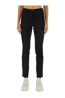Moncler Grenoble women’s black tailored trousers with sleek straight-leg cut and subtle side zippers