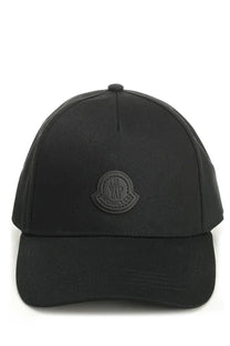 Moncler men’s black baseball hat featuring a matching embroidered logo patch on the front in durable fabric