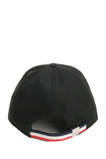 Back view of moncler men’s black baseball hat with red white and navy blue striped fabric tab
