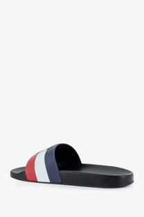 Moncler men’s Basile rubber sandal with black sole and bold red white navy striped strap