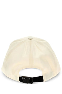 Cream-colored moncler men’s baseball cap with black adjustable strap and buckle shown from the back side