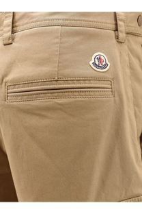 Beige moncler men’s cargo cotton chino shorts with subtle woven texture and logo patch on the back pocket backside view