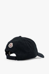 Black moncler men’s cotton baseball hat showing the back with a circular embroidered logo