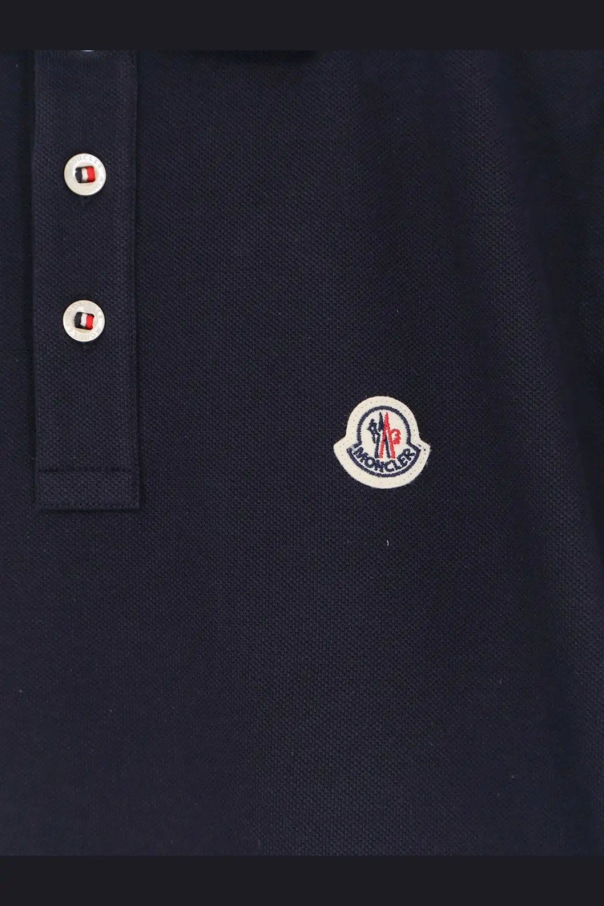 Moncler men’s cotton polo shirt in dark navy blue with white buttons and circular embroidered chest logo