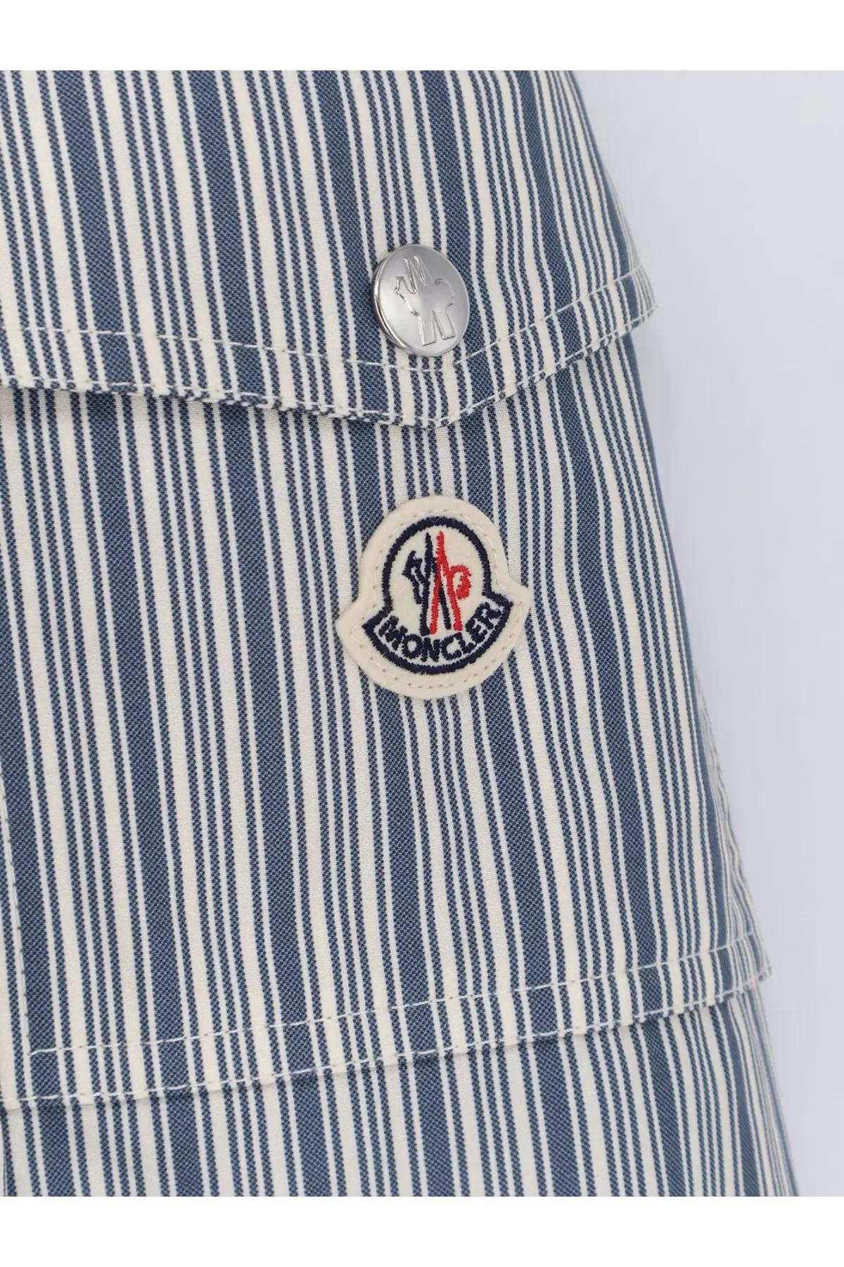 Blue and white vertically striped moncler denim shorts with silver button and embroidered logo patch