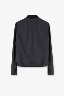 Moncler men’s hemmoor jacket in black with a sleek minimalist design and subtle sheen bomber jacket style