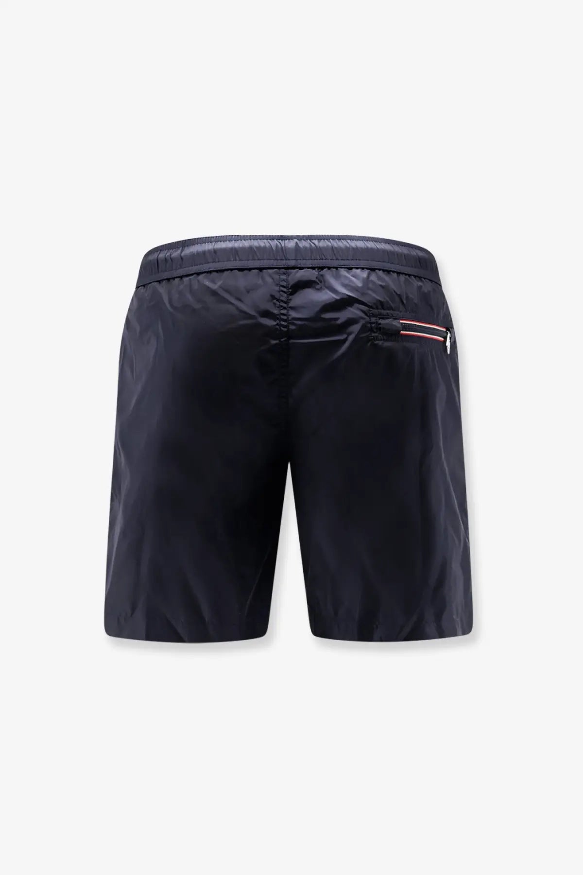 Black moncler men’s nylon swim trunks featuring a subtle red and white stripe detail on the side pocket