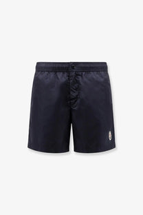Dark navy moncler men’s nylon swim trunks with a subtle logo on the lower right leg for beachwear