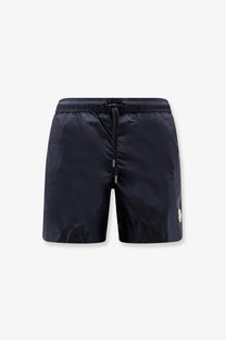 Moncler men’s dark navy nylon swim trunks with drawstring waistband and subtle side logo for swimming and beachwear