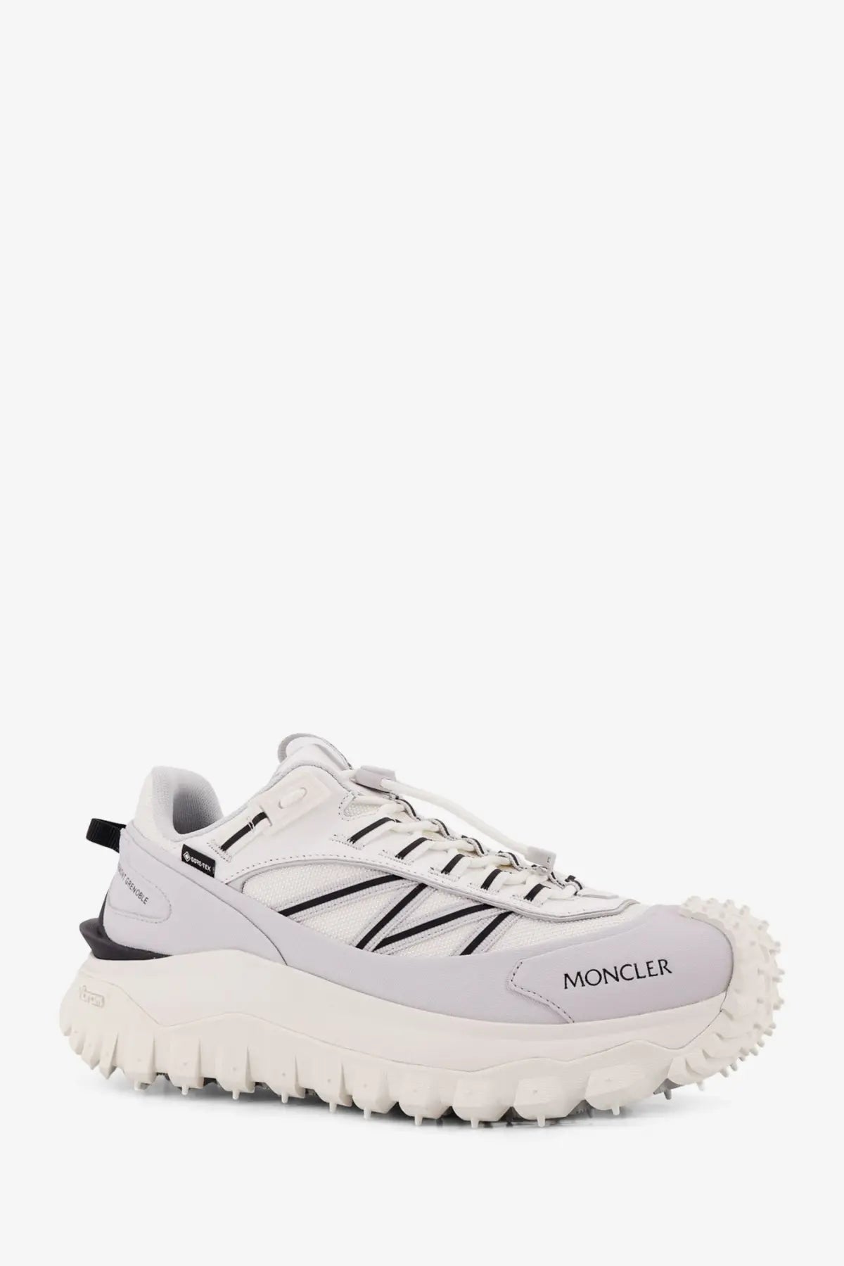 Moncler men’s trailgrip gtx leather and ripstop hiking sneaker in white with black accents and rugged textured sole
