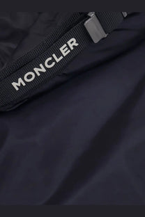 Black moncler branded strap with white lettering and metallic buckle on moncler men’s trestraou blue down jacket