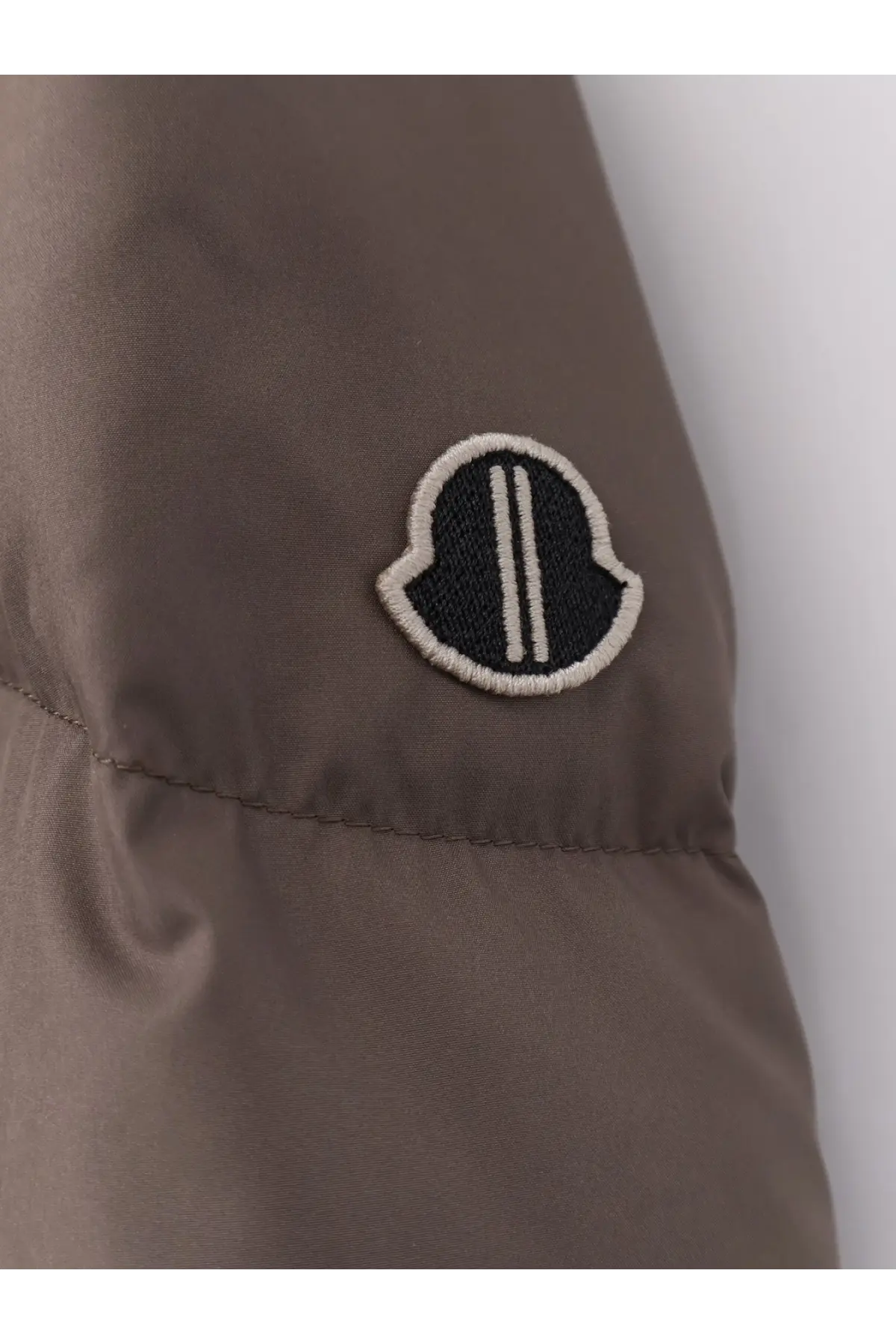 Brown moncler puffer jacket with black and white embroidered logo patch in nylon down material for men