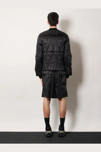 Moncler Rick Owens men’s black quilted bomber jacket with geometric stitching and modern structured silhouette