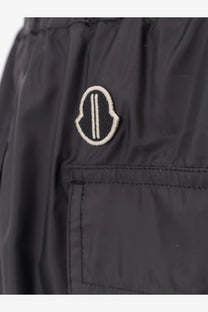 Black Moncler logo patch with white embroidered trim on dark fabric of Moncler Rick Owens men’s kiltshorts black