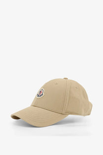 Beige moncler women’s cotton baseball hat with circular embroidered logo on the front for casual wear