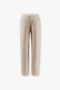 Moncler women’s cotton jogging trousers in beige with wide-leg fit elastic waistband and vertical seam detailing