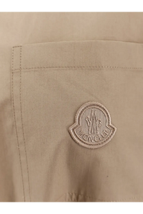 Beige moncler logo patch embroidered on a light fabric pocket of moncler women’s cotton shirt jacket beige
