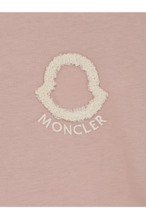 A soft pink moncler women’s cotton t-shirt featuring an off-white textured embroidered logo and brand name