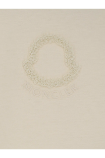 Cream-colored moncler logo embroidered on soft knit fabric of moncler womens white cotton shirt front side