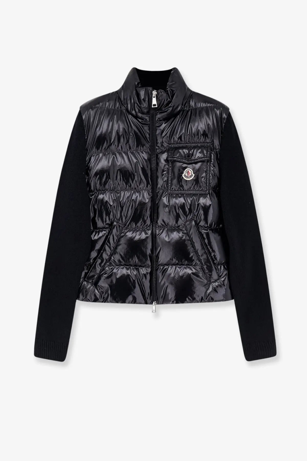 Moncler women’s black down jacket with quilted body, solid knit sleeves, front zipper, and chest pocket patch