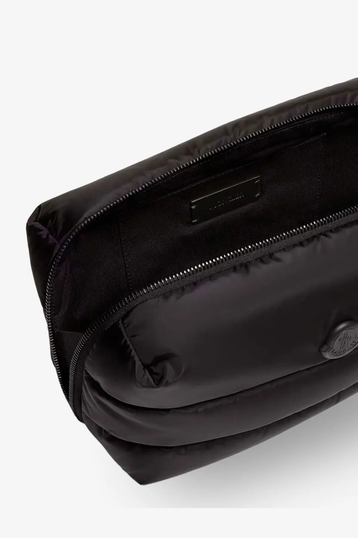 Moncler women’s black nylon puffer belt bag with quilted texture and metallic logo emblem