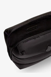 Moncler women’s black nylon puffer belt bag with quilted texture and metallic logo emblem