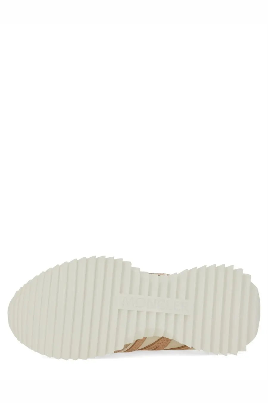 White rubber sole with textured ribbed pattern and subtle Moncler logo on beige women’s pacey sneaker back side