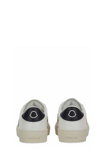Moncler women’s sneaker white in white leather with black rubber heel tabs featuring the brand logo back view