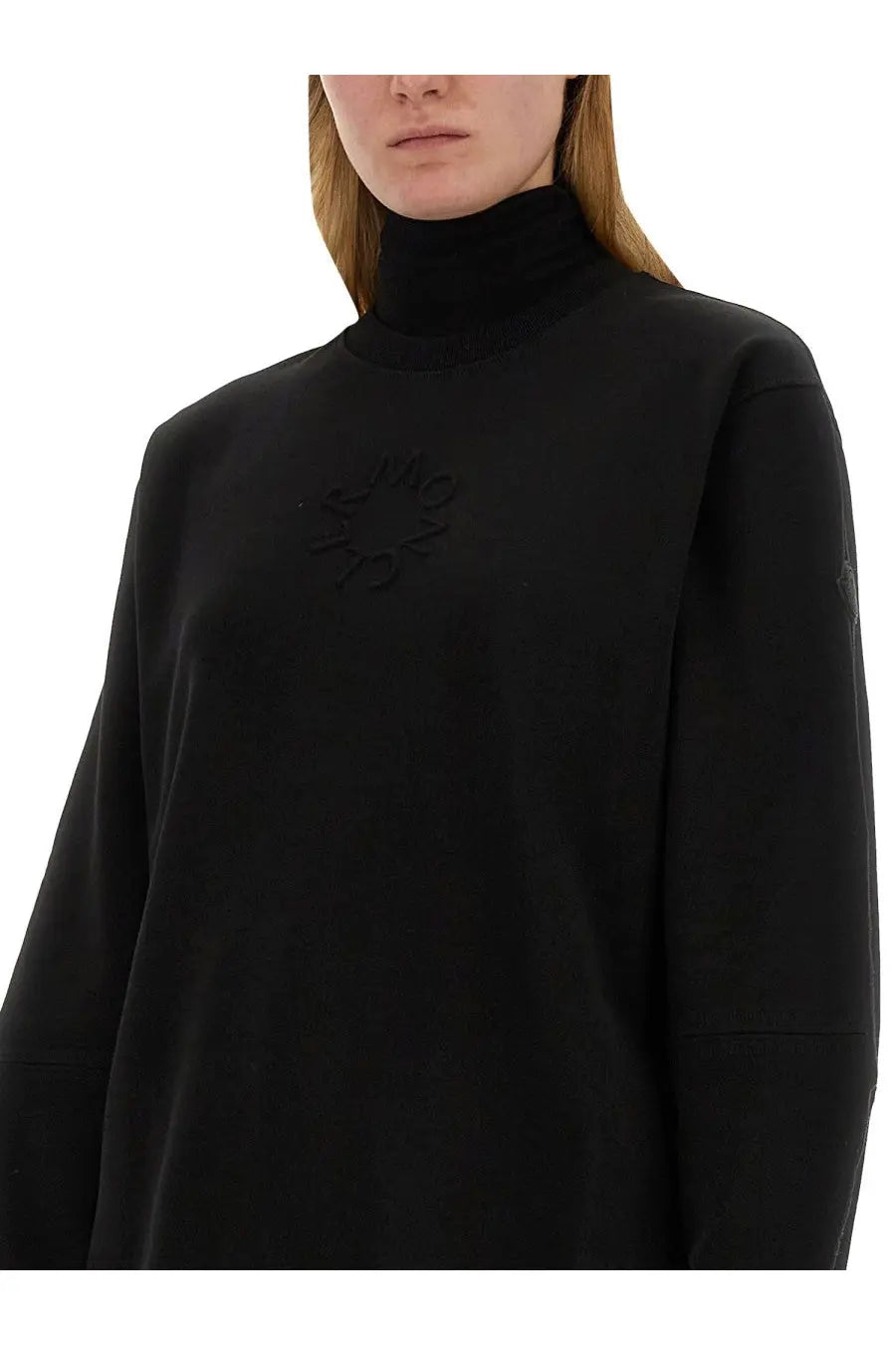 Moncler women’s black sweatshirt made of soft fabric with subtle embroidered logo on the chest and high neck design