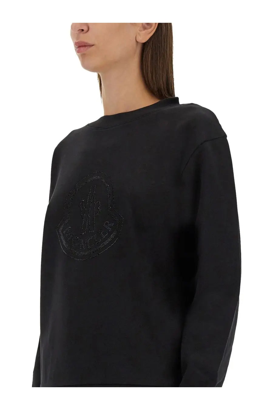 Moncler women’s black sweatshirt with subtle textured logo embroidered in matching dark thread across the chest