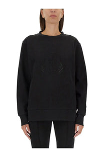 Moncler women’s black sweatshirt with subtle textured logo embroidered in matching black on the chest