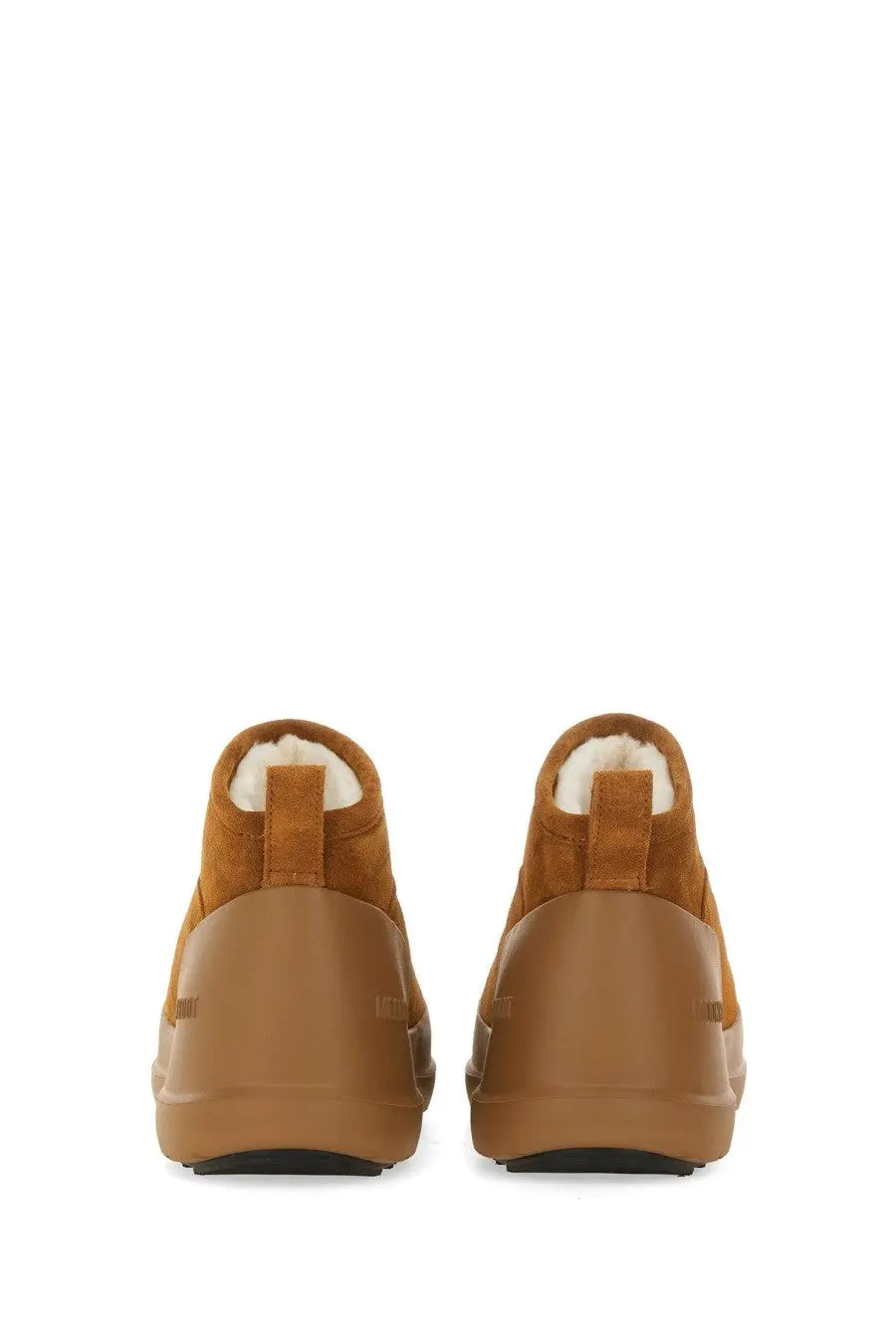 Tan suede moon boot unisex with plush white shearling lining and chunky rubber sole in beige color