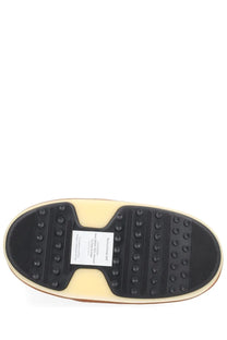 Cream-colored rubber sole with black tread and white Moon Boot label on the back of Evx Igloo beige unisex boot