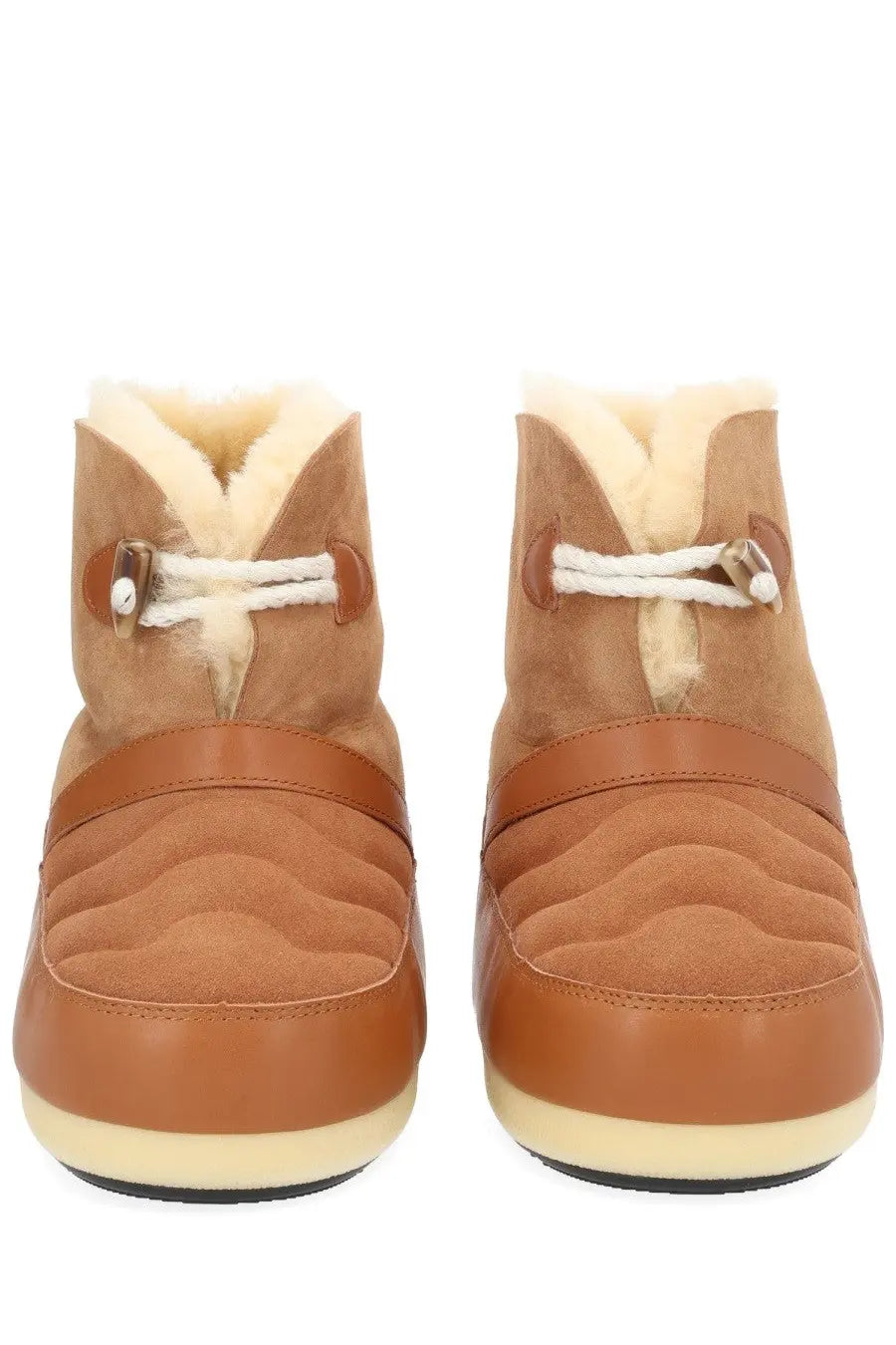 Tan suede and leather moon boot unisex ankle boots with quilted detailing white laces and plush shearling lining