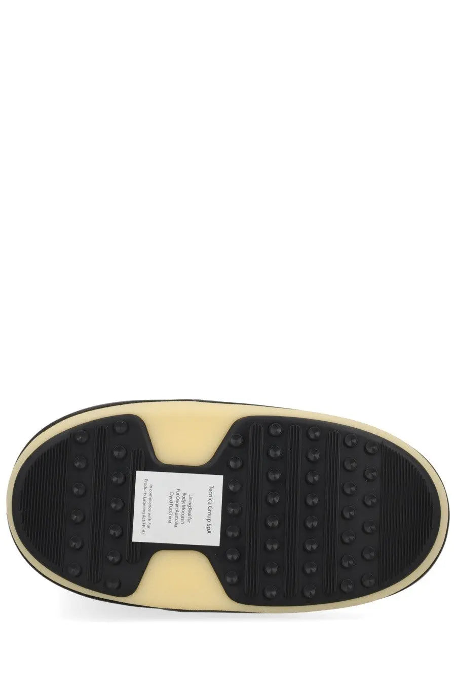Cream-colored rubber sole with black traction and white tommy hilfiger label on moon boot unisex evx igloo black back